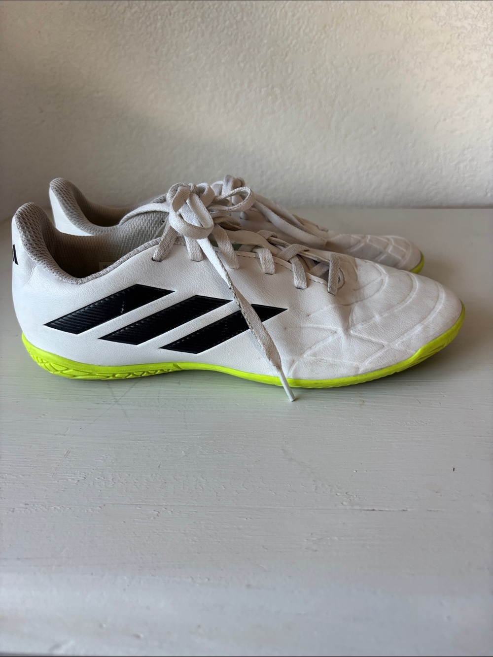 adidas White Kids Indoor Soccer Shoes with Black Stripes and Neon Yellow Sole
